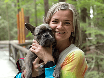 Woman holding small dog