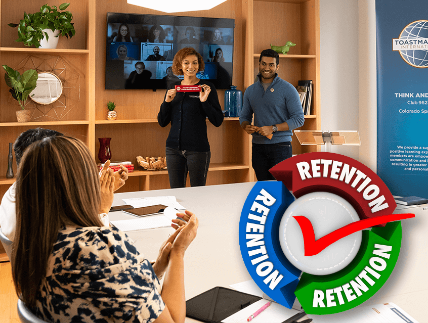 Woman holing up blue ribbon with people applauding around her