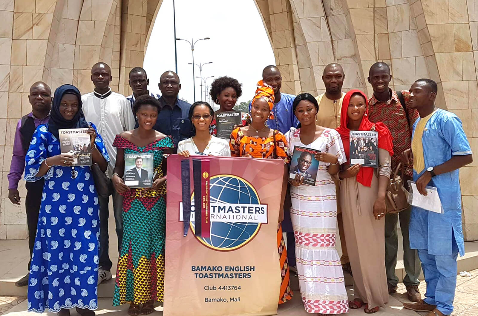 Bamako English 91传媒 club members gather under the Place de l'ind茅pendance monument in Bamako, Mali.